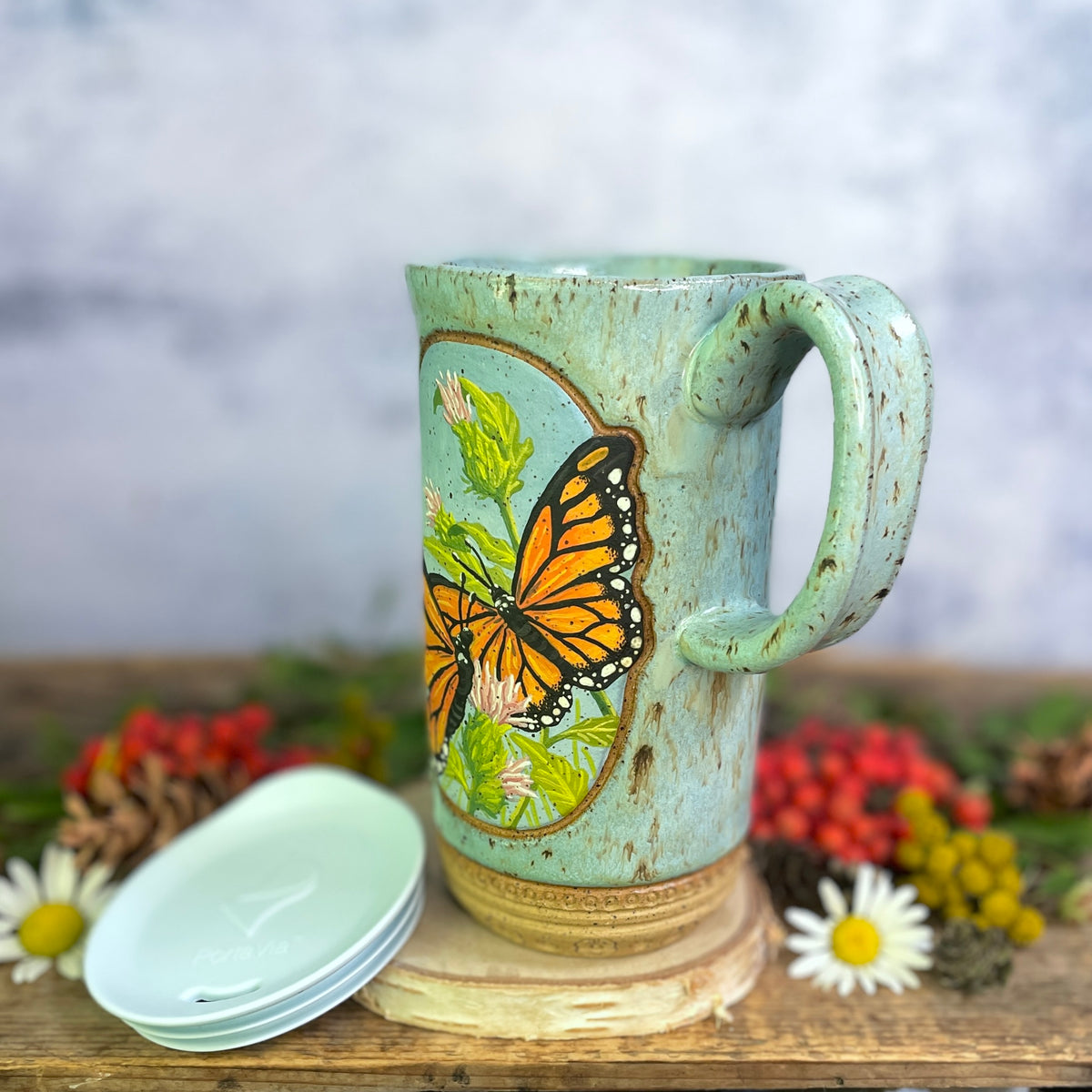 58. 18oz. Pair of Monarch Butterflies and thistle Travel Mug