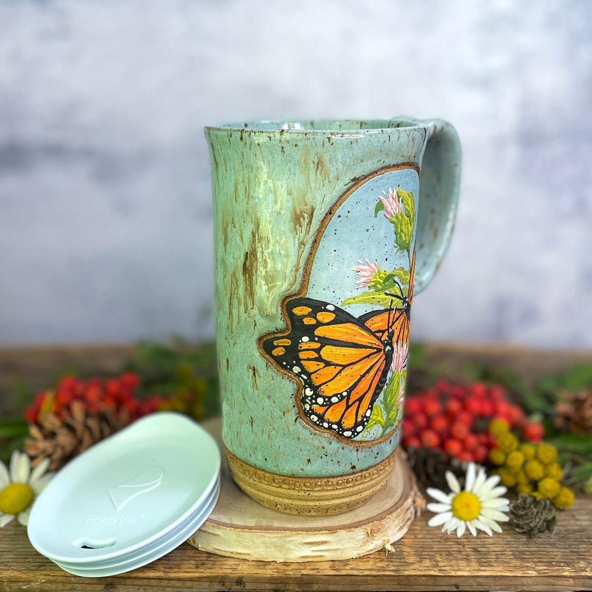 58. 18oz. Pair of Monarch Butterflies and thistle Travel Mug